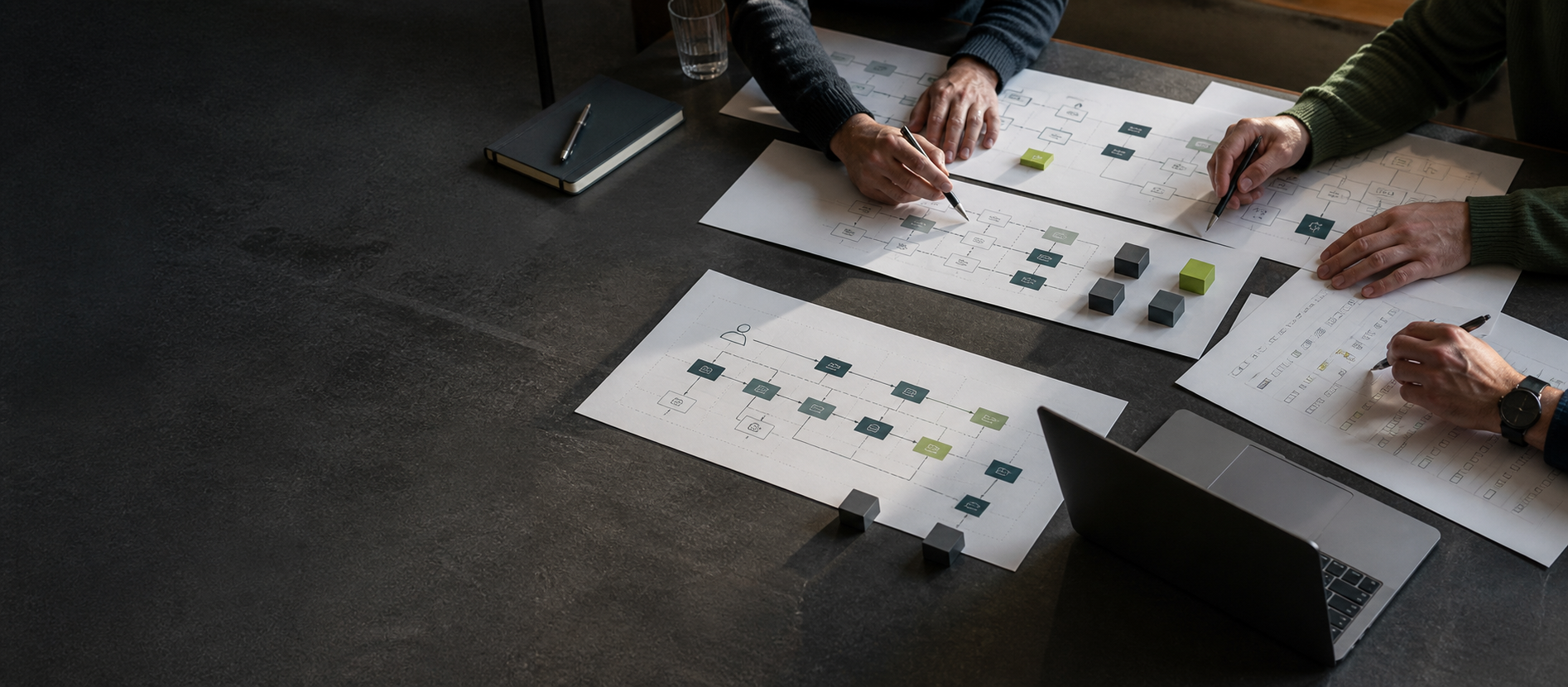 Technical specialists reviewing architecture diagrams and an upgrade delivery plan